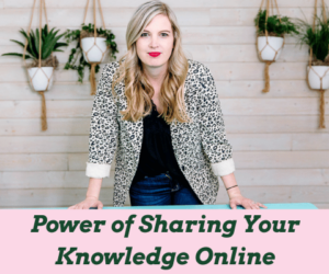 Jamie Trull confidently stands in a power pose at her desk, reflecting her determination to share what is possible for other women in business