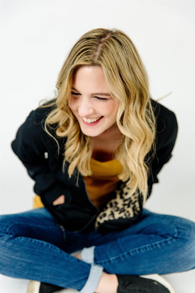 picture of Jamie Trull sitting cross legged. The ultimate fempreneur! Jamie helps other women entrepreneurs grow profitable businesses.
